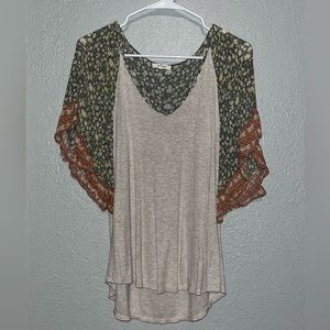 Fits like a size small/medium, floral sleeve top from Maurice’s